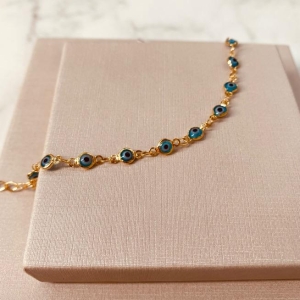 PL OURO OLHO GREGO AZUL CLARO