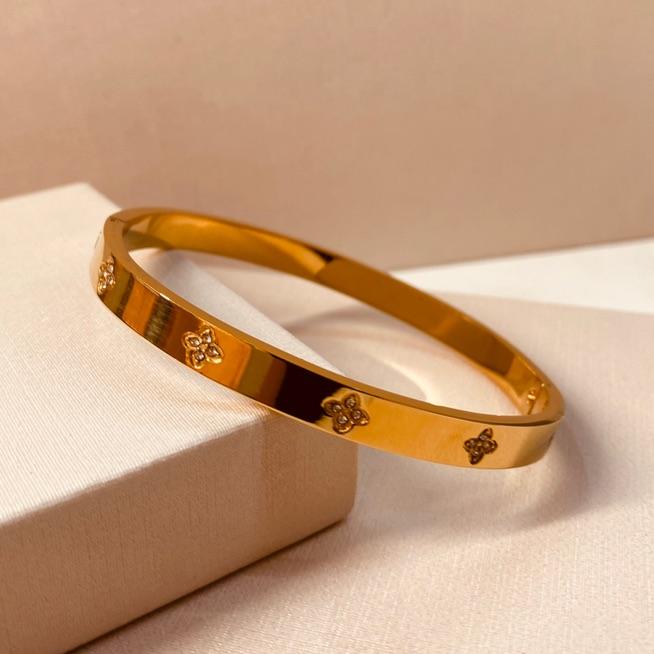 BRAC AÇO OURO LISO FLORES VAN PEQUENAS