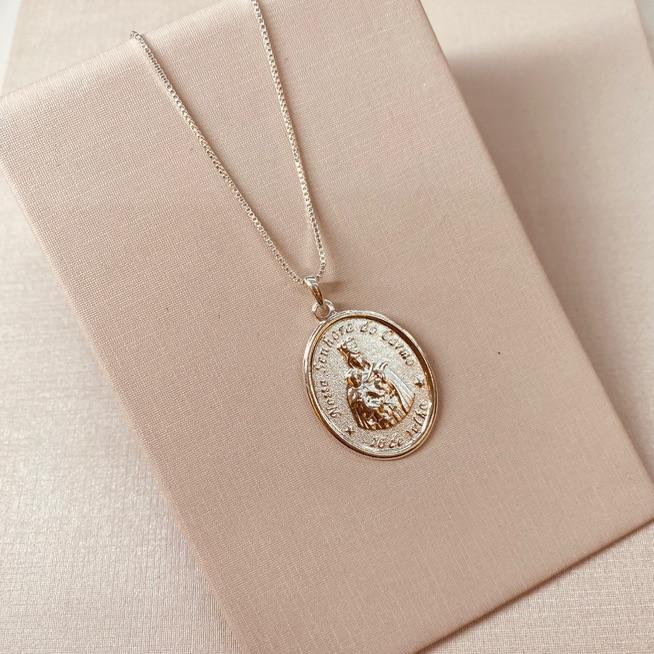 CL PRATA OVAL NSA SENHORA DO CARMO